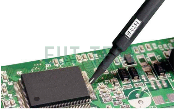 Slowly move the near-field probe over the PCB under test to find the source of the radiation interference emission.